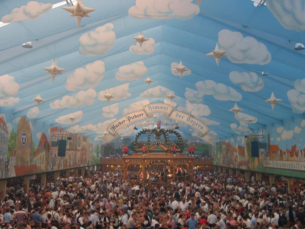 Crowds celebrating inside a packed beer tent at Oktoberfest in Munich, Germany